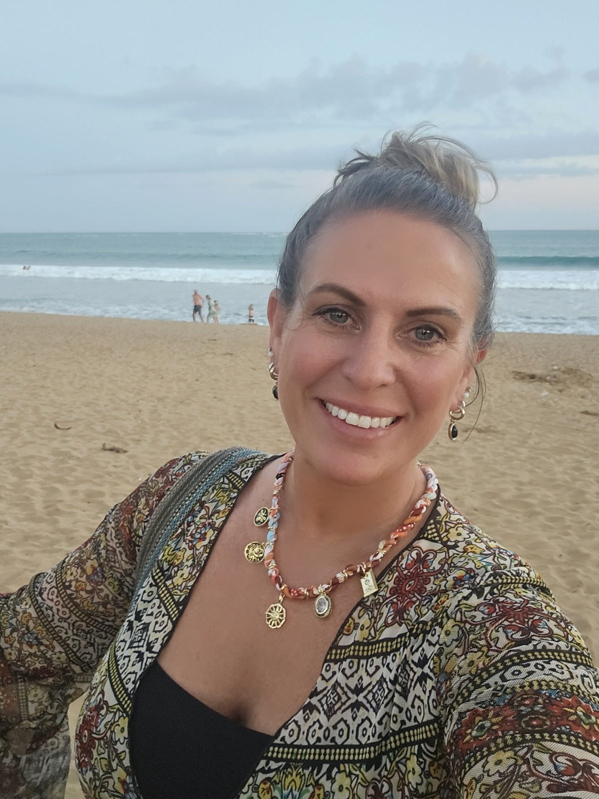 Jamie Ruth, LPCC — Licensed Professional Clinical Counselor, smiling on the beach at golden hour